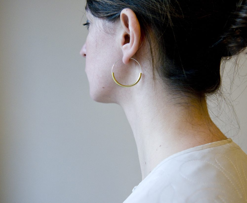 Silver hoops with brass curve