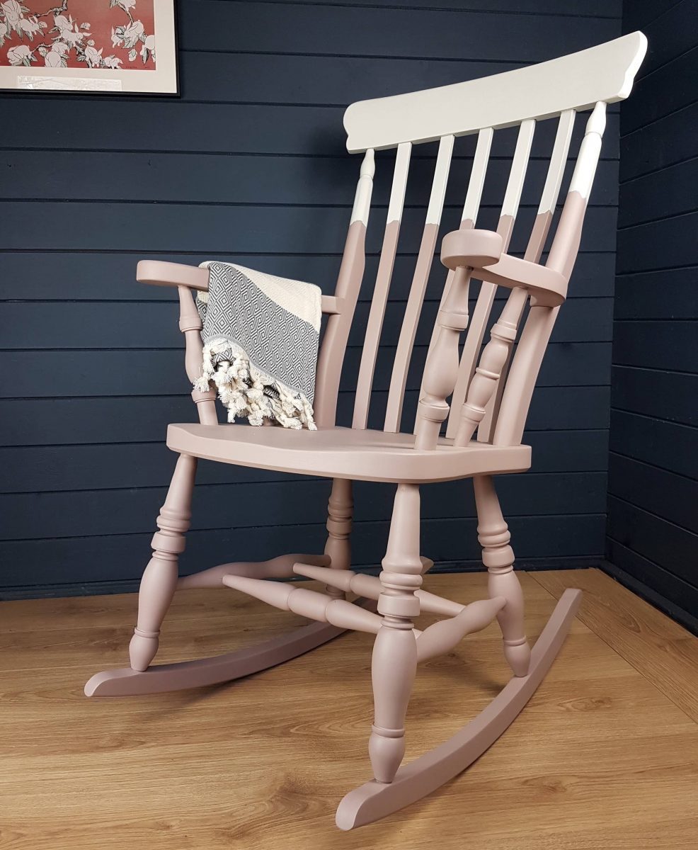 Two-tone pink and white painted wooden rocking chair