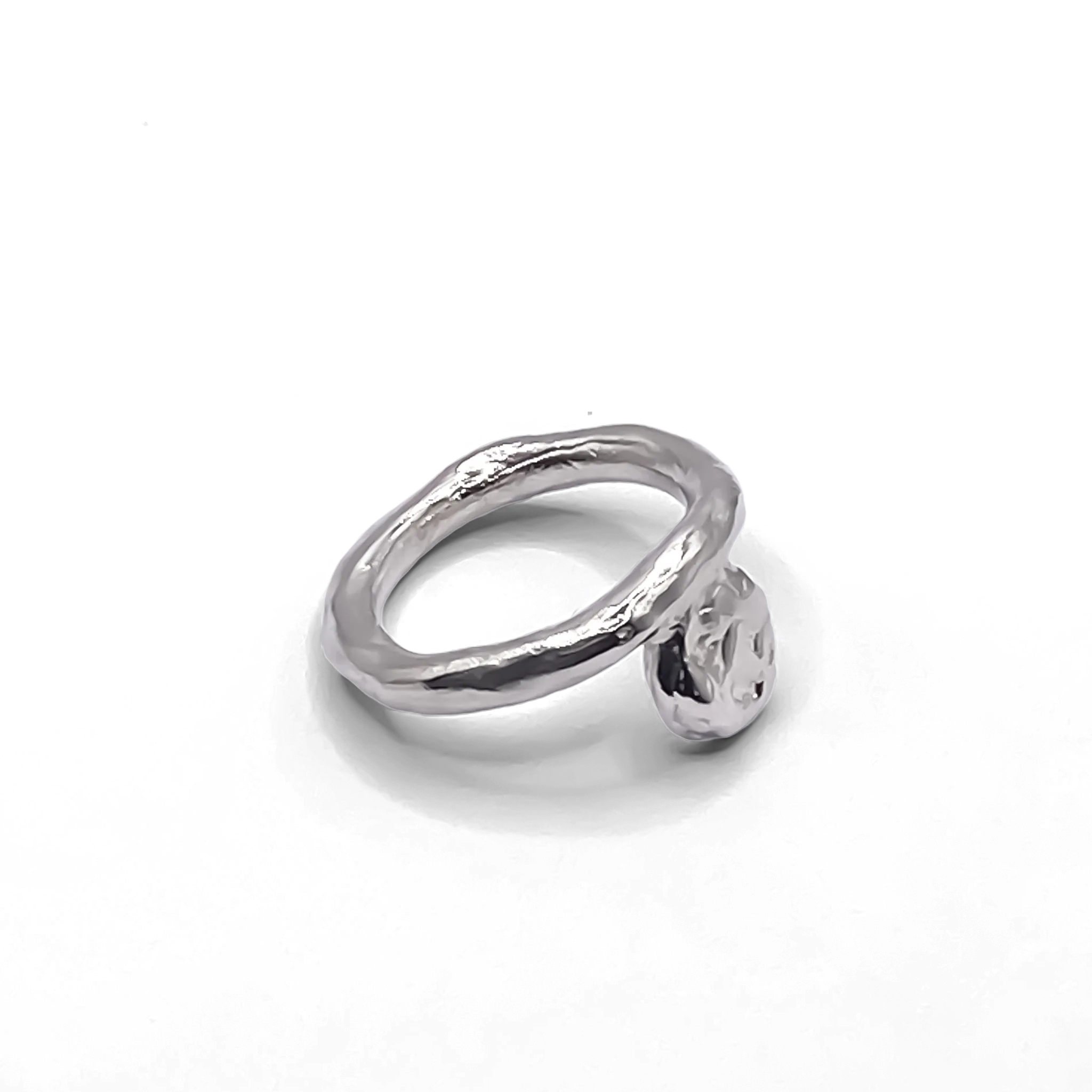 Sterling silver Circle Accent Ring with smooth circular face on a white background