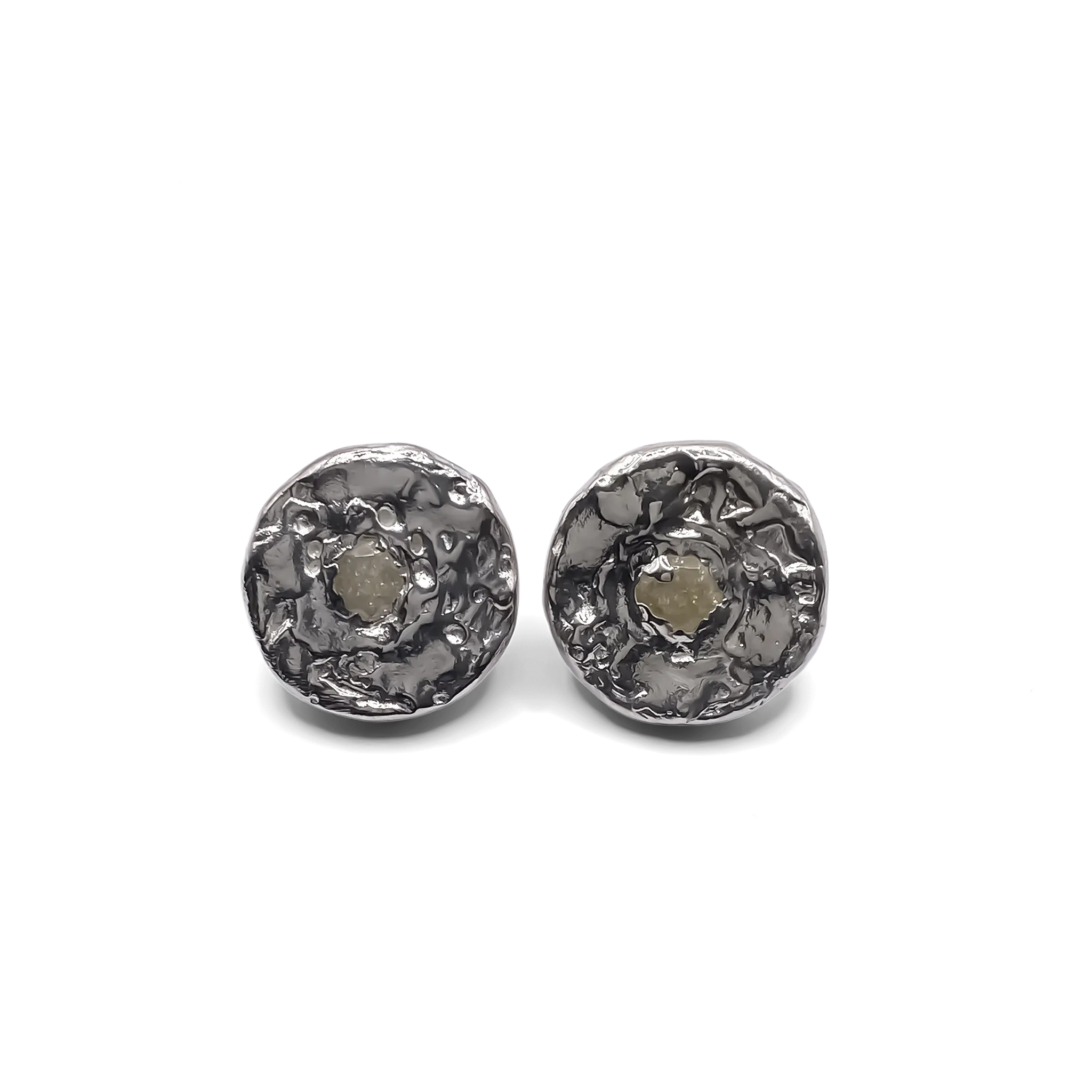 Pair of Grain Circle Stud Earrings on white background