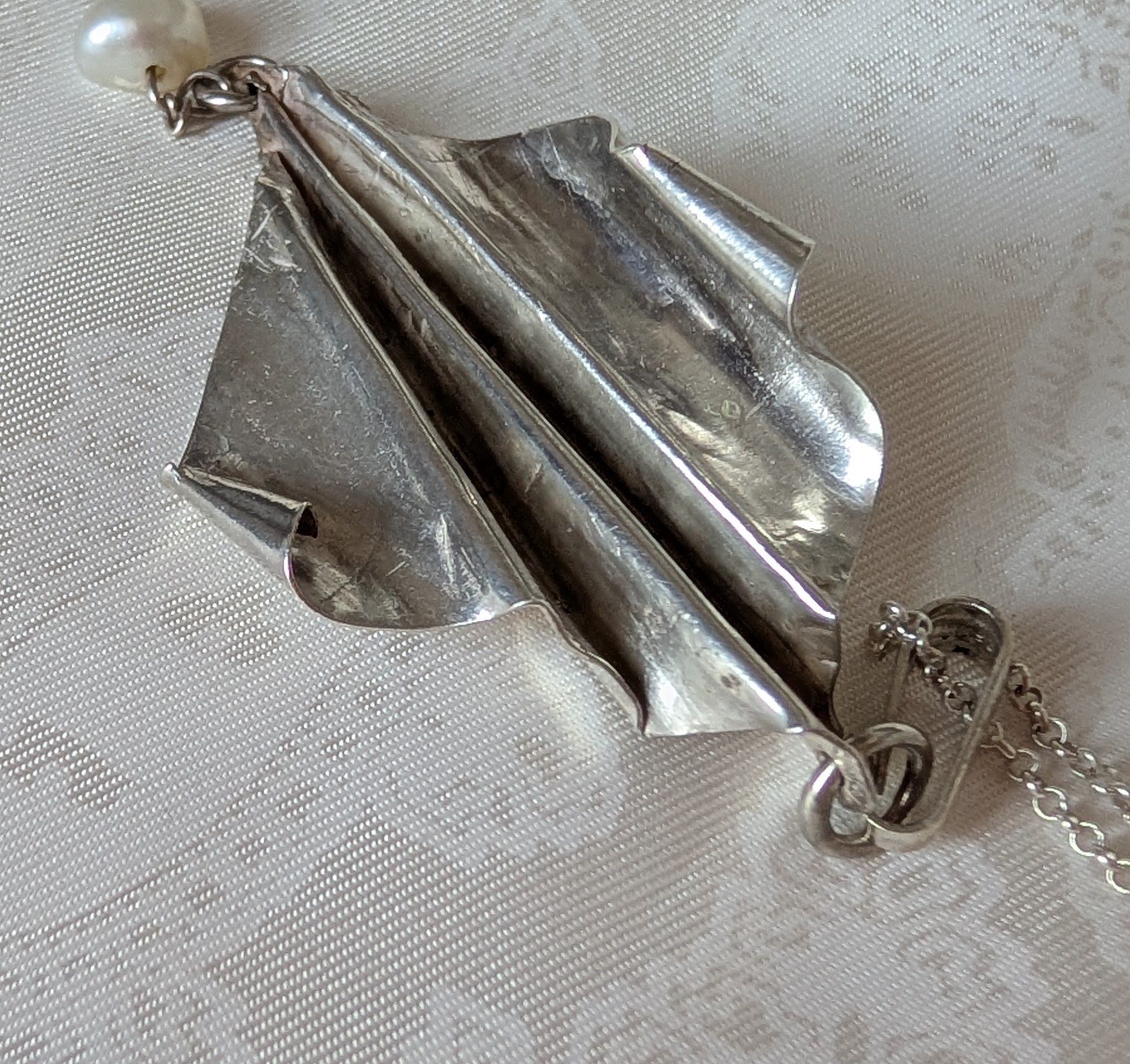 Fold formed silver pendant