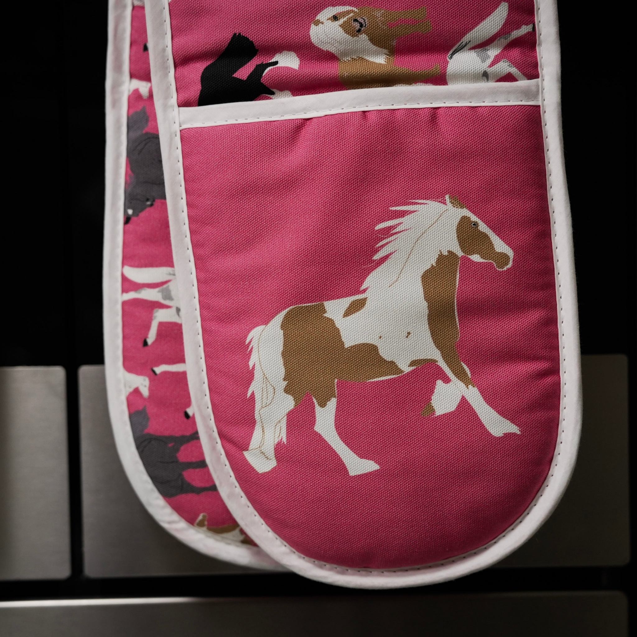 Pink organic cotton oven gloves with horses illustrations